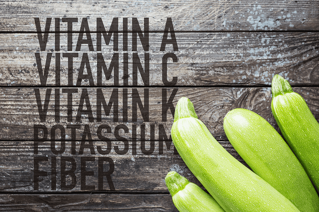 Colors: Green, Fresh Vegetables, Zucchini on Rustic Wooden Background.