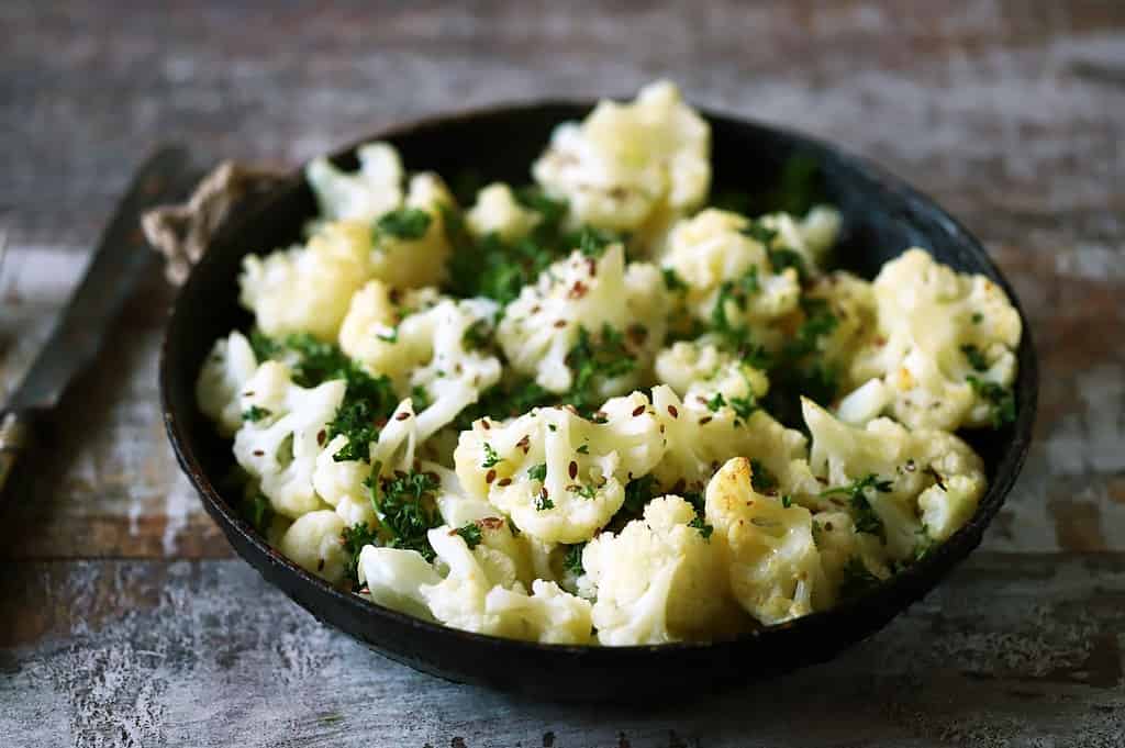 Healthy homemade cauliflower dog treats garnished with parsley. Perfect for nutritious, vet-approved canine snacks.