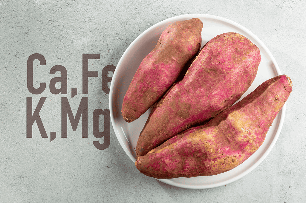 Organic sweet potatoes in a white bowl, healthy dog treat ingredients, nutritious, vet-approved.