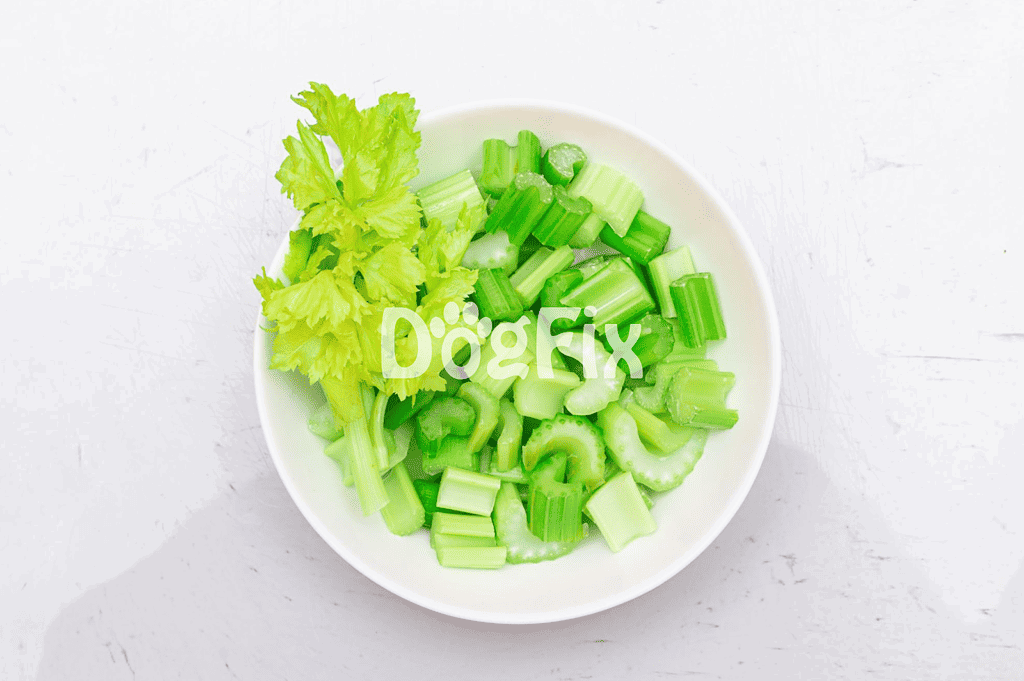 Fresh chopped celery in a bowl, ideal for healthy dog treats and canine nutrition.