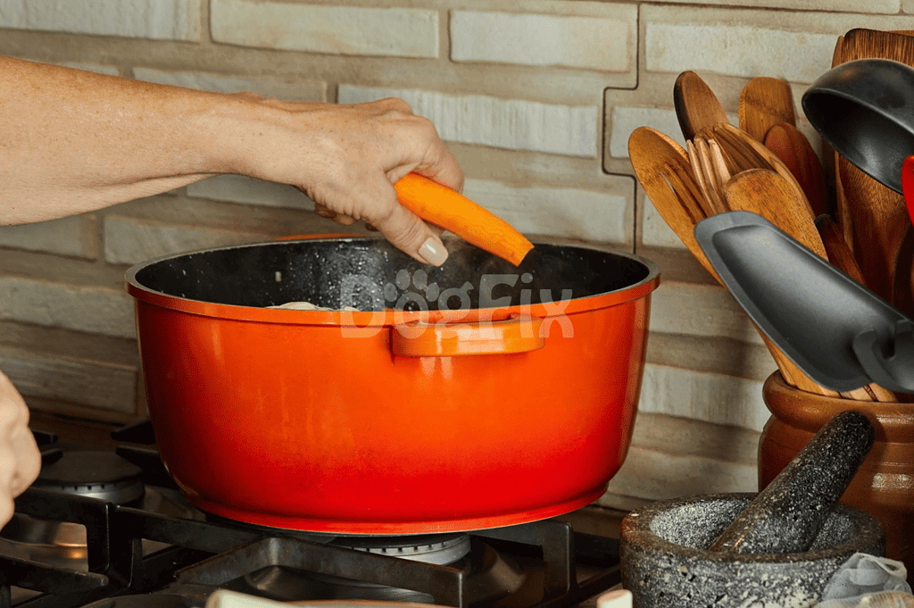 Close-up of a person adding a carrot to a cooking pot in a kitchen scene.