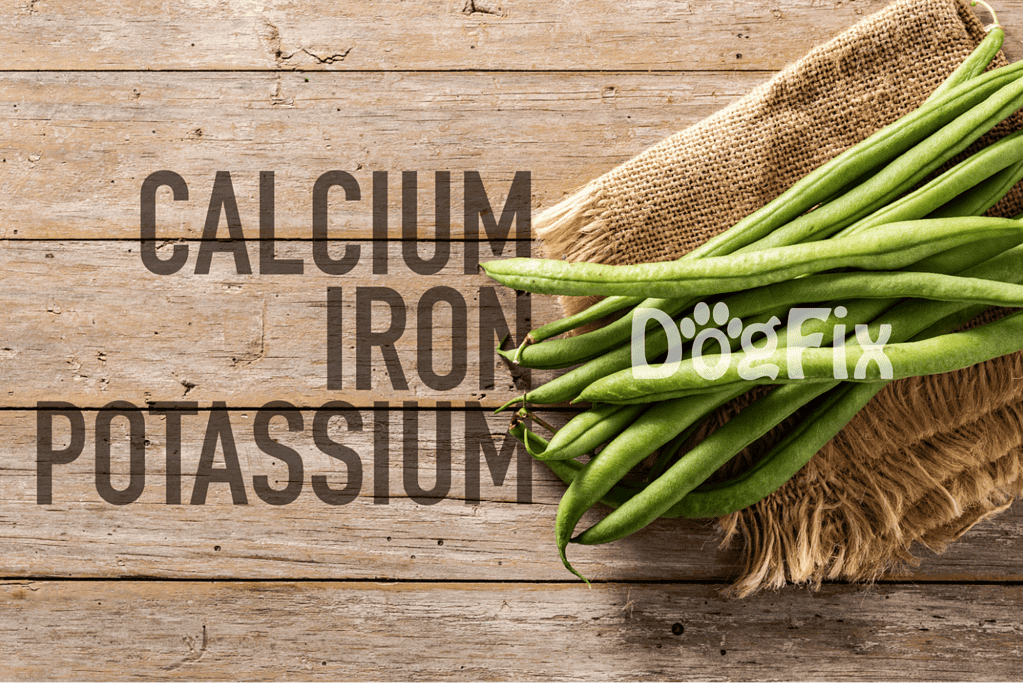 Fresh green beans spilling out of a burlap sack on a wooden surface.