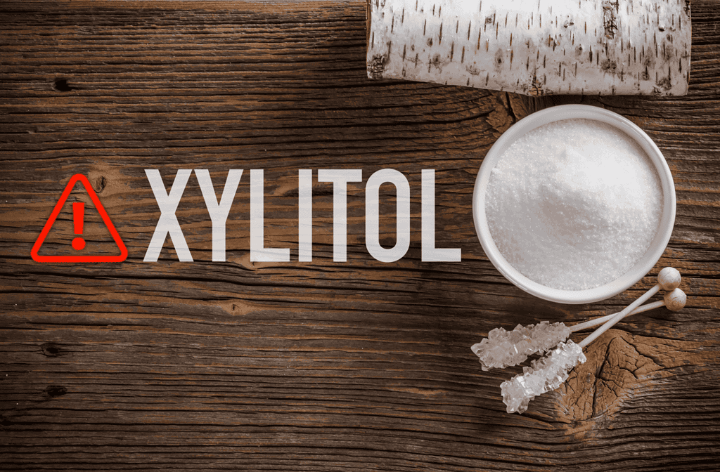 Warning sign about dog dangers of xylitol, a sugar substitute toxic to pets. Keep xylitol away from dogs to prevent poisoning.