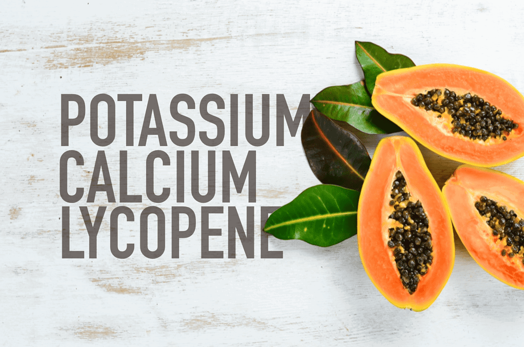 Fresh papaya cut open showing black seeds, emphasizing nutrient content and health benefits.