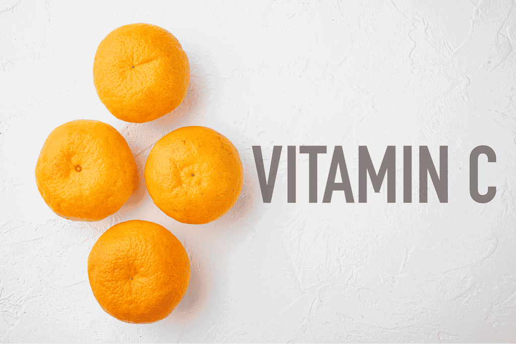 Bright oranges on white background with "Vitamin C" text.