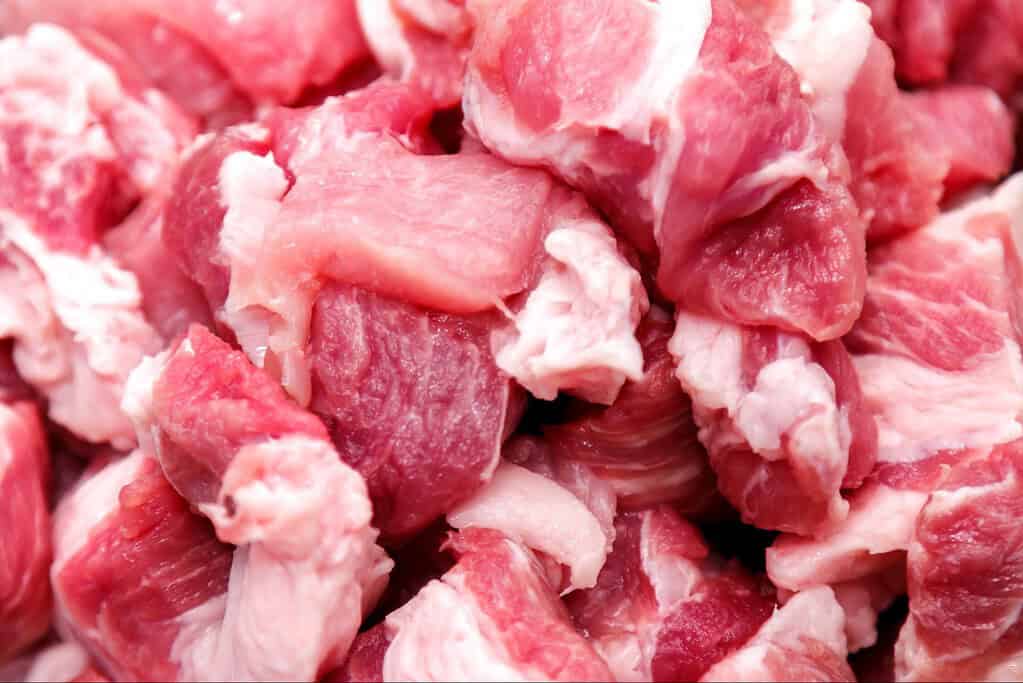 Close-up of raw, chopped meat perfect for pet diets and dog food supplements.