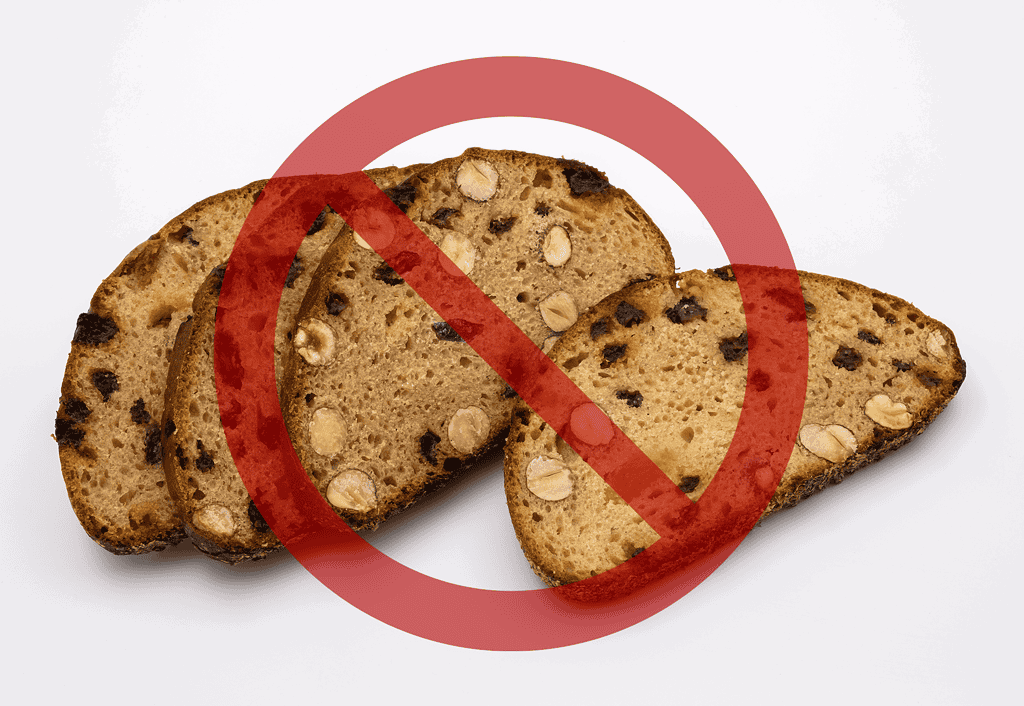 Alt text: Image showing dog treats with a red prohibition sign.