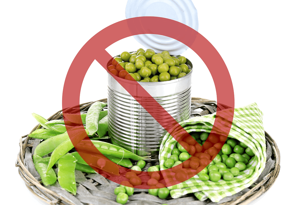 Natural fresh or frozen peas are best for canine health.