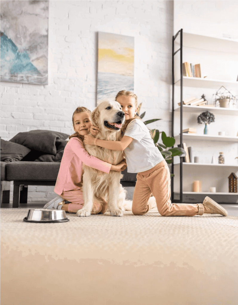 Cute children with loyal dog cuddling on living room floor, family pet care, joyful canine companionship.