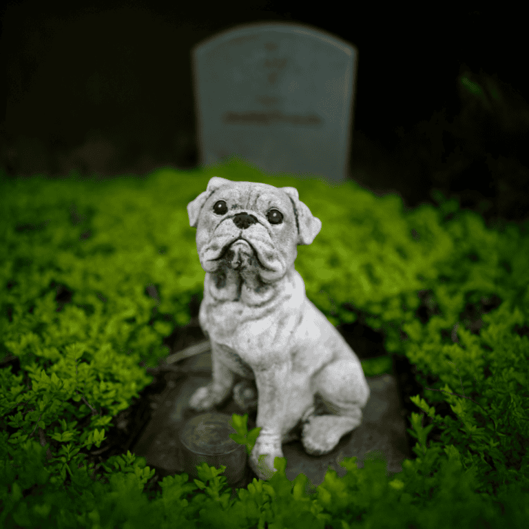Dog statue, pet memorial, garden ornament, bulldog sculpture, outdoor pet tribute.