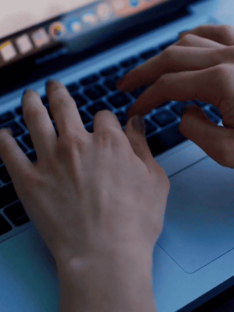 Keyboard typing on laptop, close-up shot.