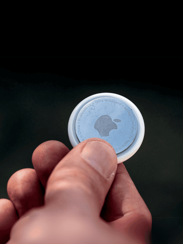 Small Bluetooth tracker with Apple Find My compatibility for pets, keys, and valuables.