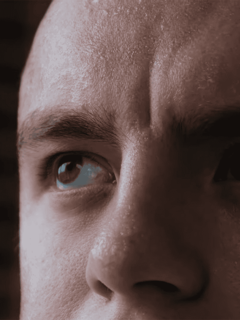 Close-up of a person's face highlighting skin texture and eye, perfect for skin care tips.