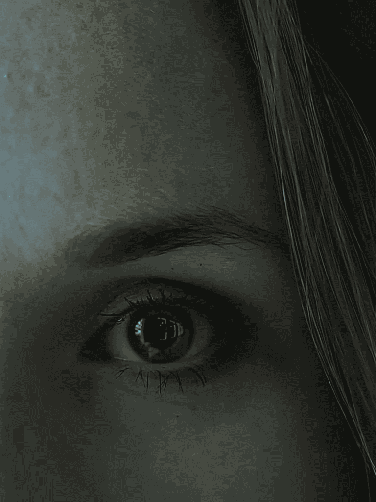 Close-up of a human eye, emphasizing detailed eyelashes and eyebrow with a mysterious tone.