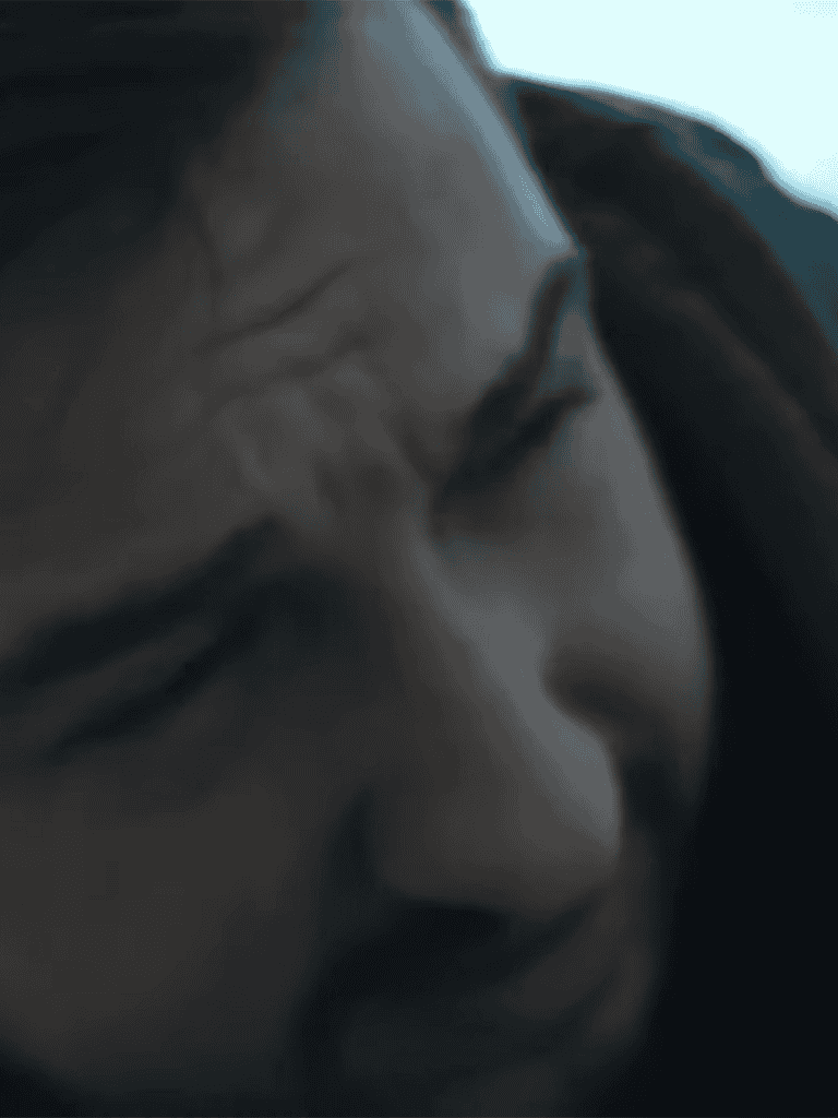 Close-up of stressed woman touching her forehead, expressing frustration or anxiety.