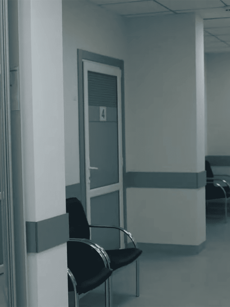 Comfortable vet waiting area with chairs and numbered door for pet checkups.