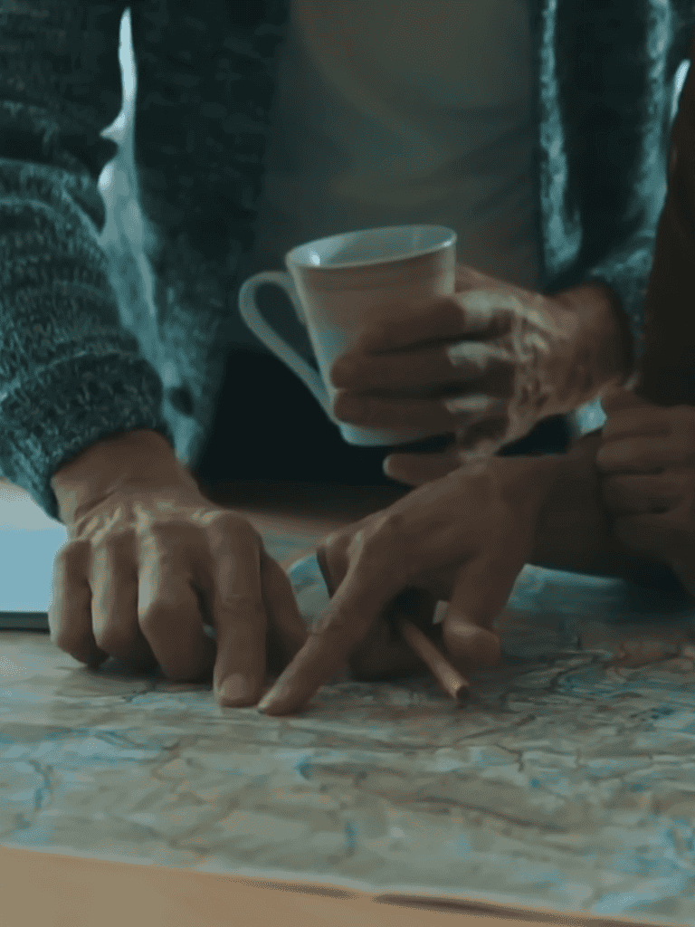 A person and a dog examining a map together, emphasizing pet training and behavior education.